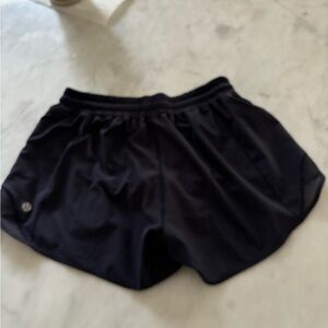Lululemon navy Hotty Hot size 4, 4”, inside label removed for comfort.